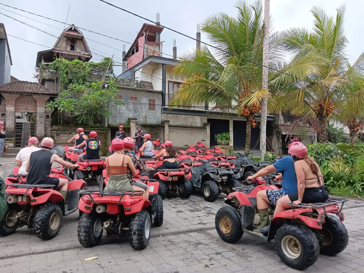 A group riding ATVs on a jungle trail near Ubud