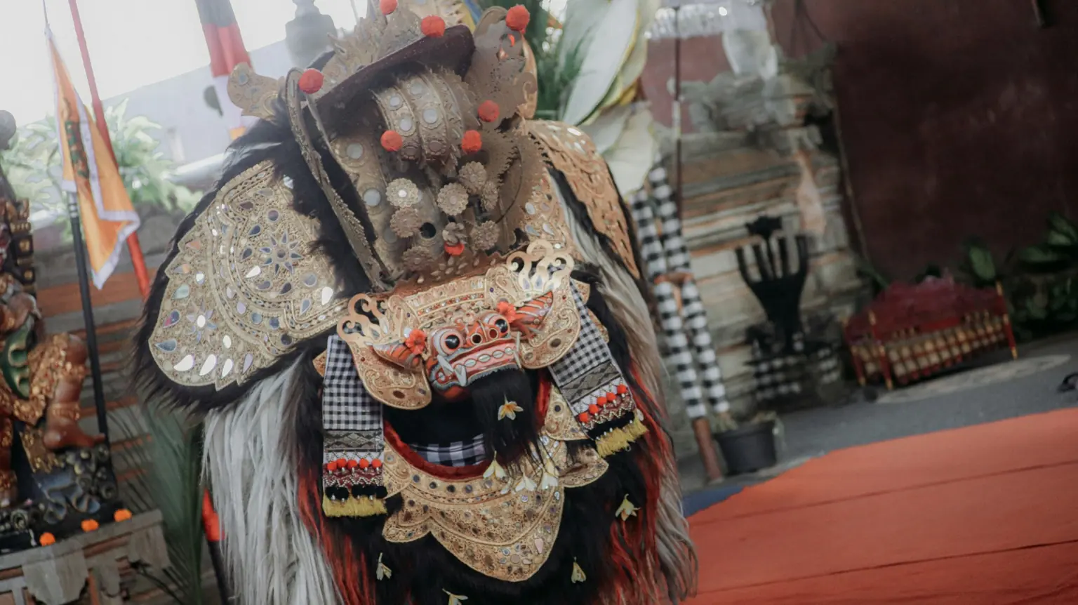 Barong and Rangda facing off in a Balinese dance drama