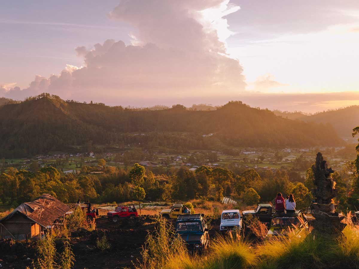 Sunrise view over Mount Batur from a jeep tour stop