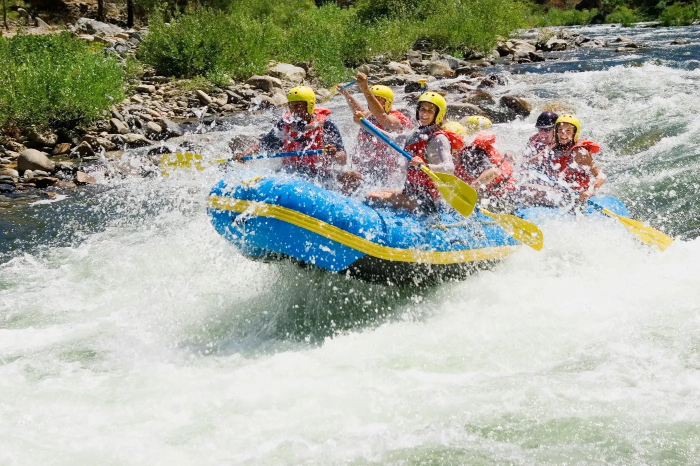 A rafting crew punching through whitewater rapids on the Ayung River